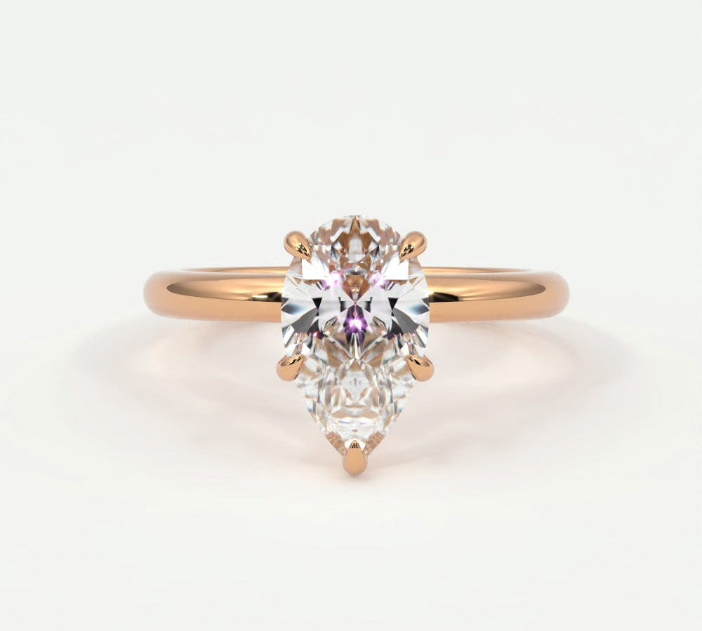 Rings 14K Rose Gold / 7 Pear Shape Diamond Solitaire Band